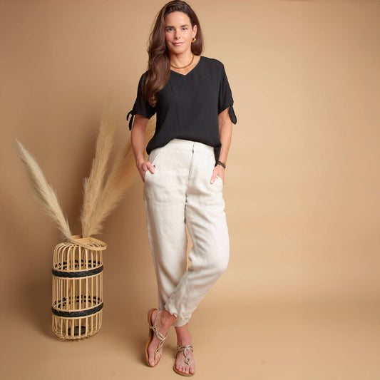 Elsie & Zoey Nika Crepe tied short sleeve V-neck blouse featuring a stylish design and lightweight fabric, shown on a model.