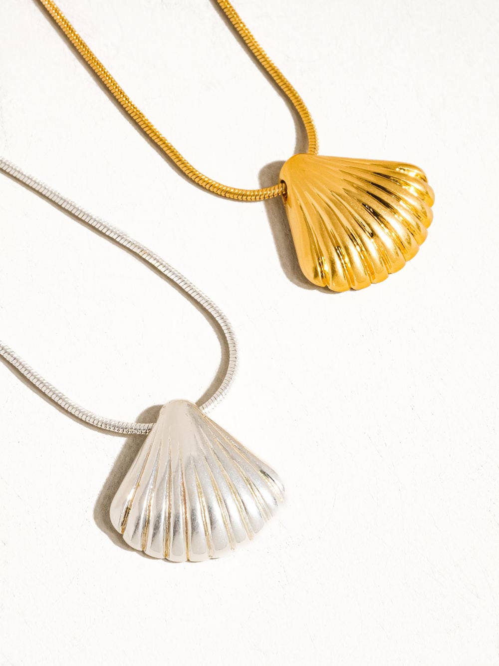 Cosmic Classic Shell Necklace by Flanerie by MAIQ featuring a delicate shell pendant on a silver chain.