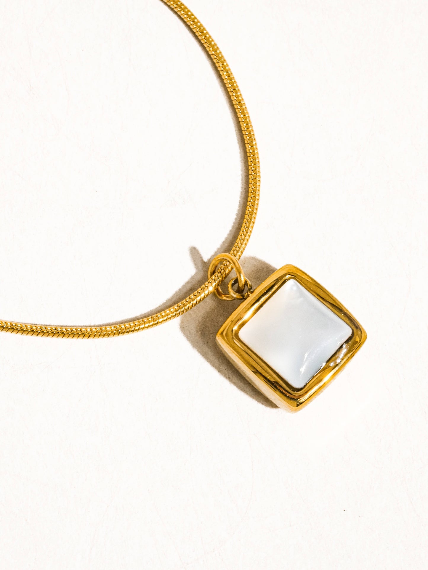 18K gold non-tarnish square shell necklace featuring a sleek, elegant design with a secure chain clasp.