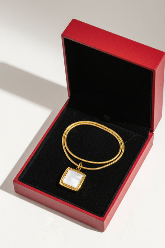 18K gold non-tarnish square shell necklace by Flanerie by MAIQ, featuring a delicate square shell pendant on a gold chain.