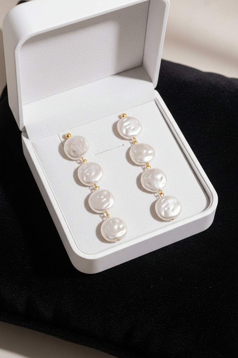 18K non-tarnish pearl drop earring by Flanerie by MAIQ, featuring a sleek gold hook and a lustrous pearl pendant.