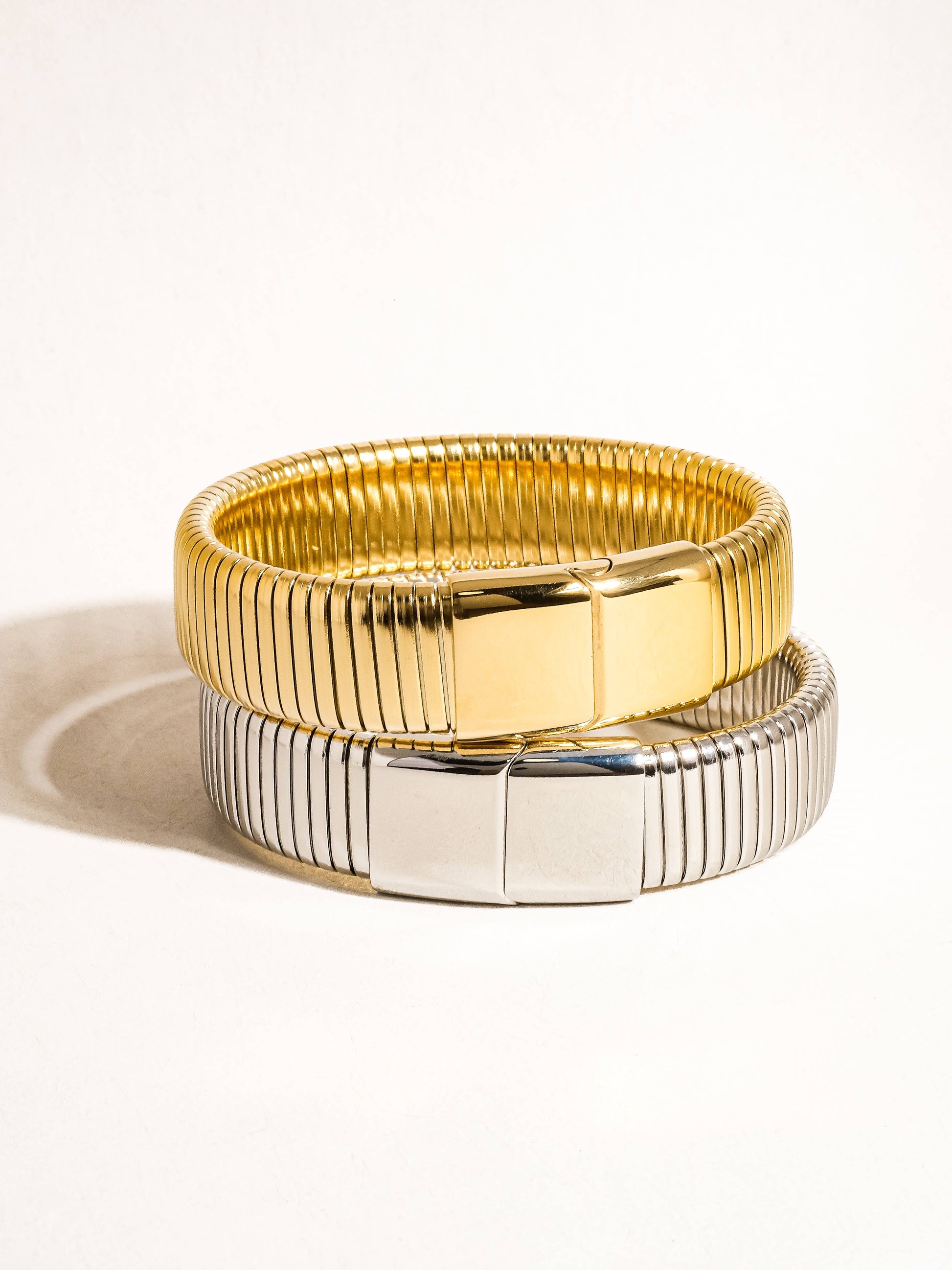 Christel 18K gold non-tarnish stripe bold bangle by Flanerie by MAIQ, showcasing its shiny gold finish and striking design.