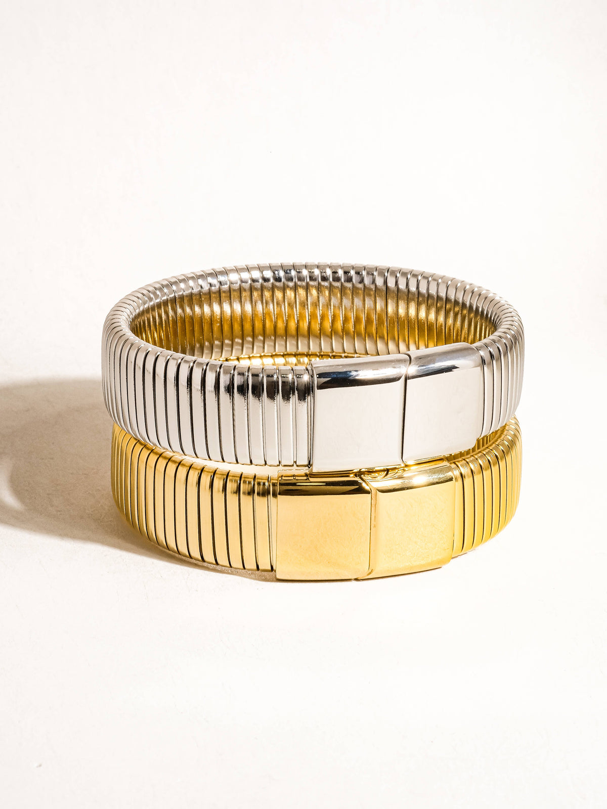 Christel 18K gold non-tarnish stripe bold bangle by Flanerie, featuring a sleek, modern design with contrasting gold and stripe details.