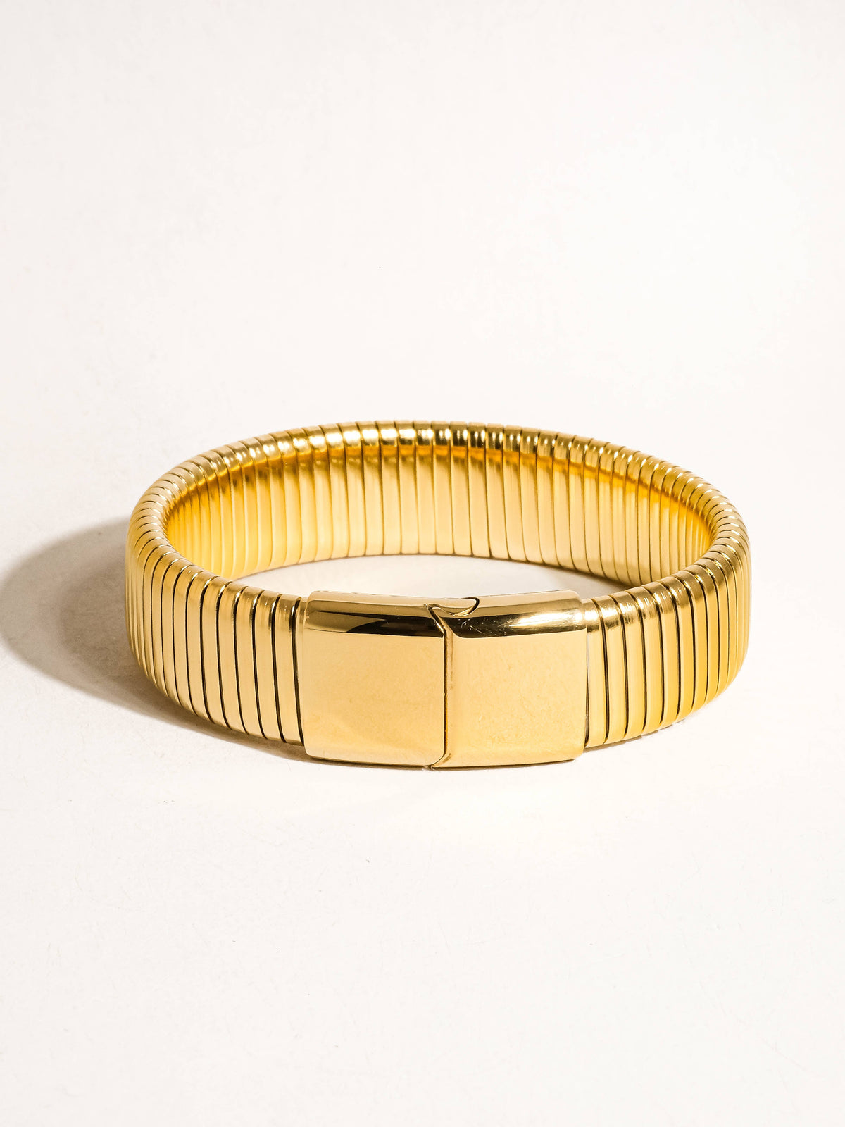 Christel 18K gold non-tarnish stripe bold bangle by Flanerie by MAIQ, featuring a sleek gold finish and stylish striped design.
