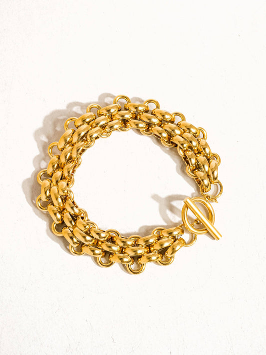 Donni 18K gold non-tarnish bold weave bracelet by Flanerie by MAIQ, featuring a chunky gold link design.