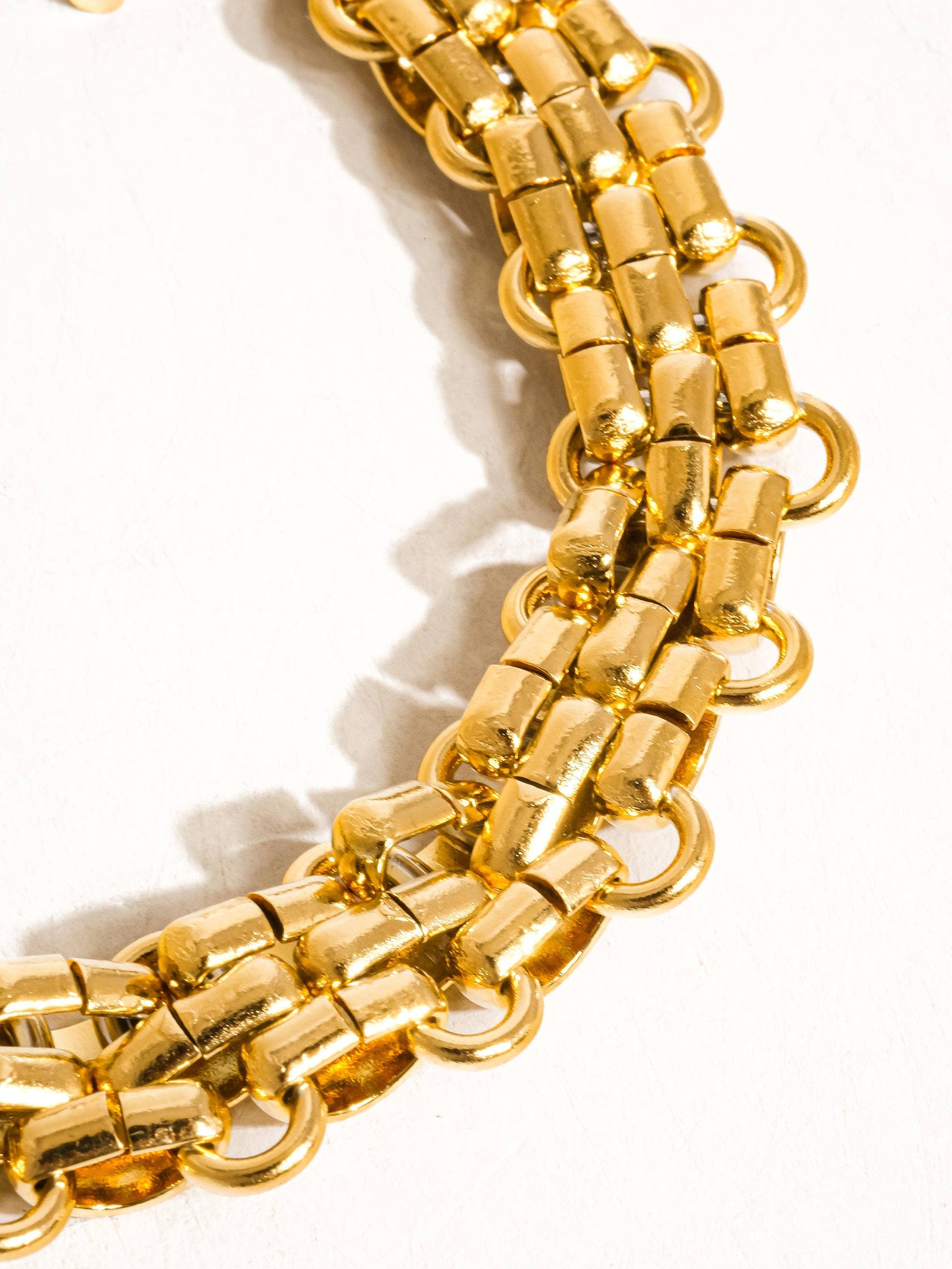 Donni 18K gold non-tarnish bold weave bracelet with intricate braided design, crafted by Flanerie by MAIQ.