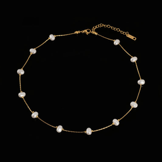 Ida 18K non-tarnish petite pearl necklace by Flanerie by MAIQ, featuring a delicate string of lustrous pearls.