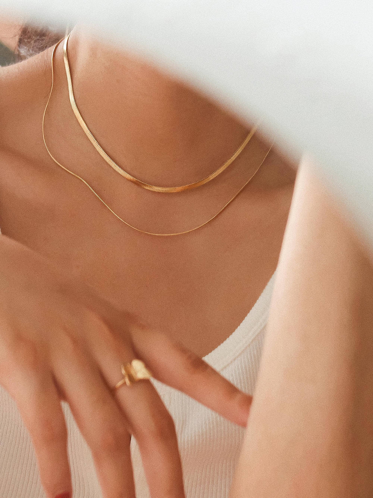 18K gold layered flat snake chain necklace by Flanerie by MAIQ, showcasing a sleek, non-tarnish gold jewelry design