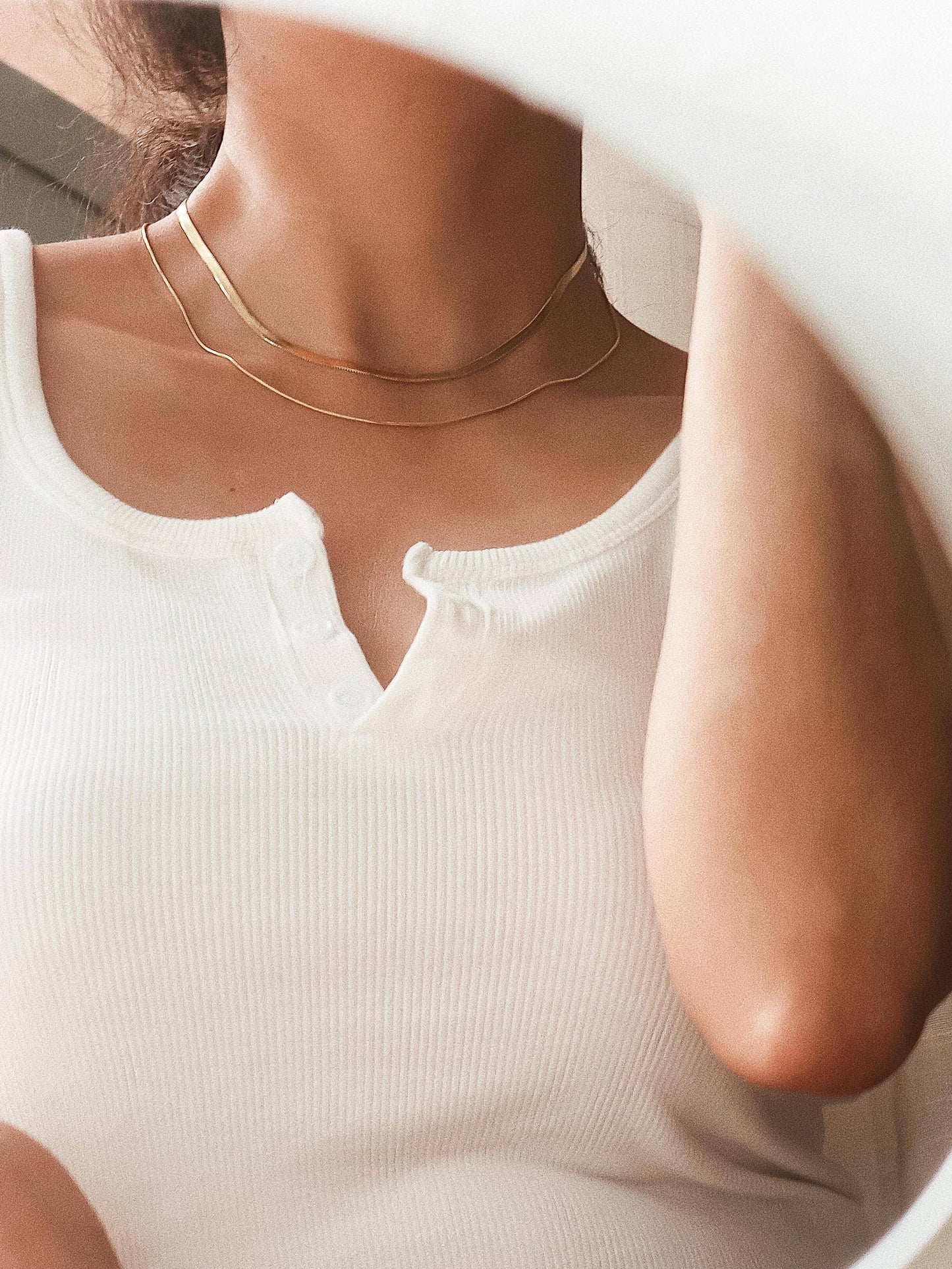 18K gold layered flat snake chain necklace by Flanerie by MAIQ, featuring a non-tarnish finish and smooth snake chain design.