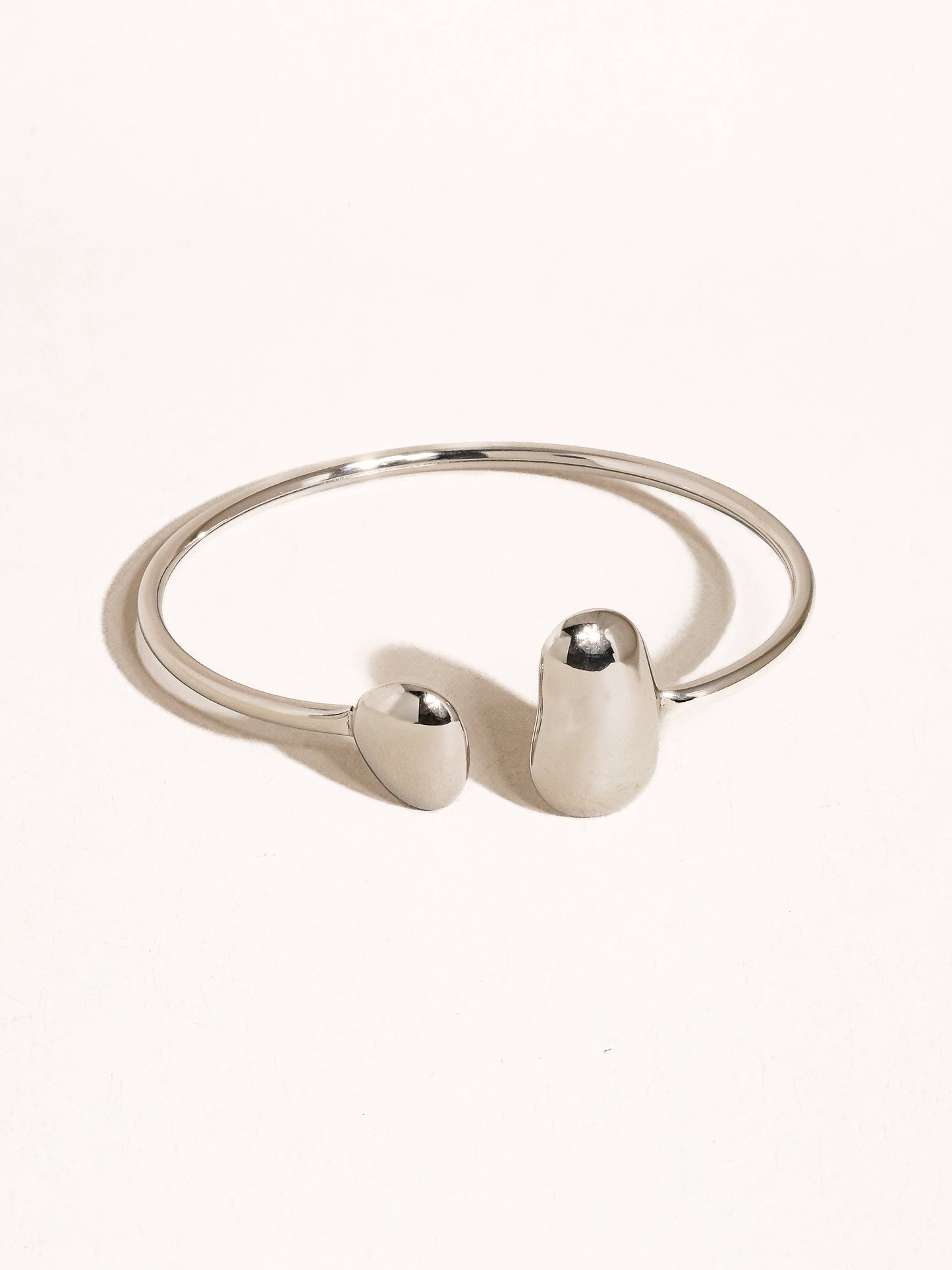 Mazie 18K non-tarnish round thin bracelet by Flanerie by MAIQ, featuring a delicate, polished gold finish on a slender chain.