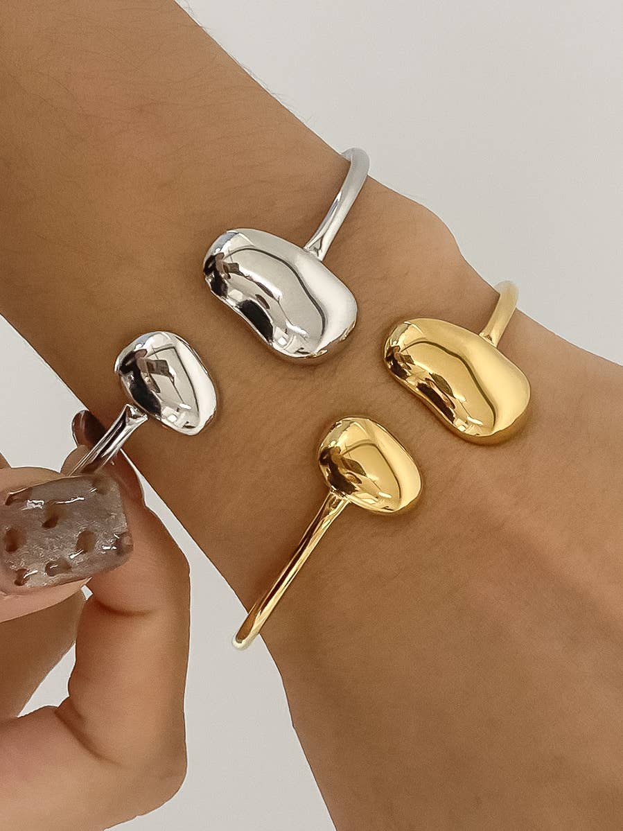 Mazie 18K non-tarnish round thin bracelet by Flanerie by MAIQ, showcasing a sleek, minimalist gold jewelry design.