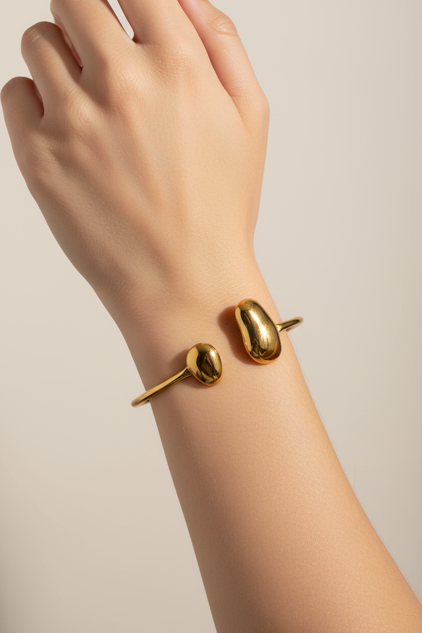 Gold Mazie 18K non-tarnish round thin bracelet by Flanerie by MAIQ, featuring a delicate, sleek design.