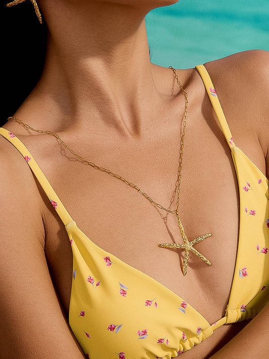 Suki 18K gold non-tarnish statement star necklace by Flanerie by MAIQ, featuring a bold star pendant on a delicate chain.