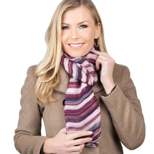 Howard's Dayton lightweight striped sheer scarf with subtle pastel and neutral tones, draped to showcase its soft, airy fabric.