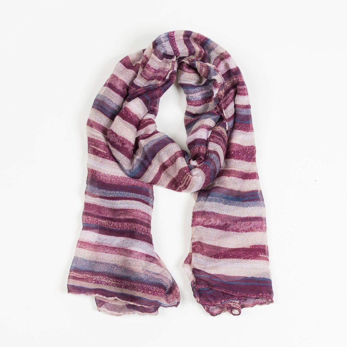 Howard's Dayton lightweight striped sheer scarf draped elegantly, showcasing its soft, airy fabric and stylish striped pattern.