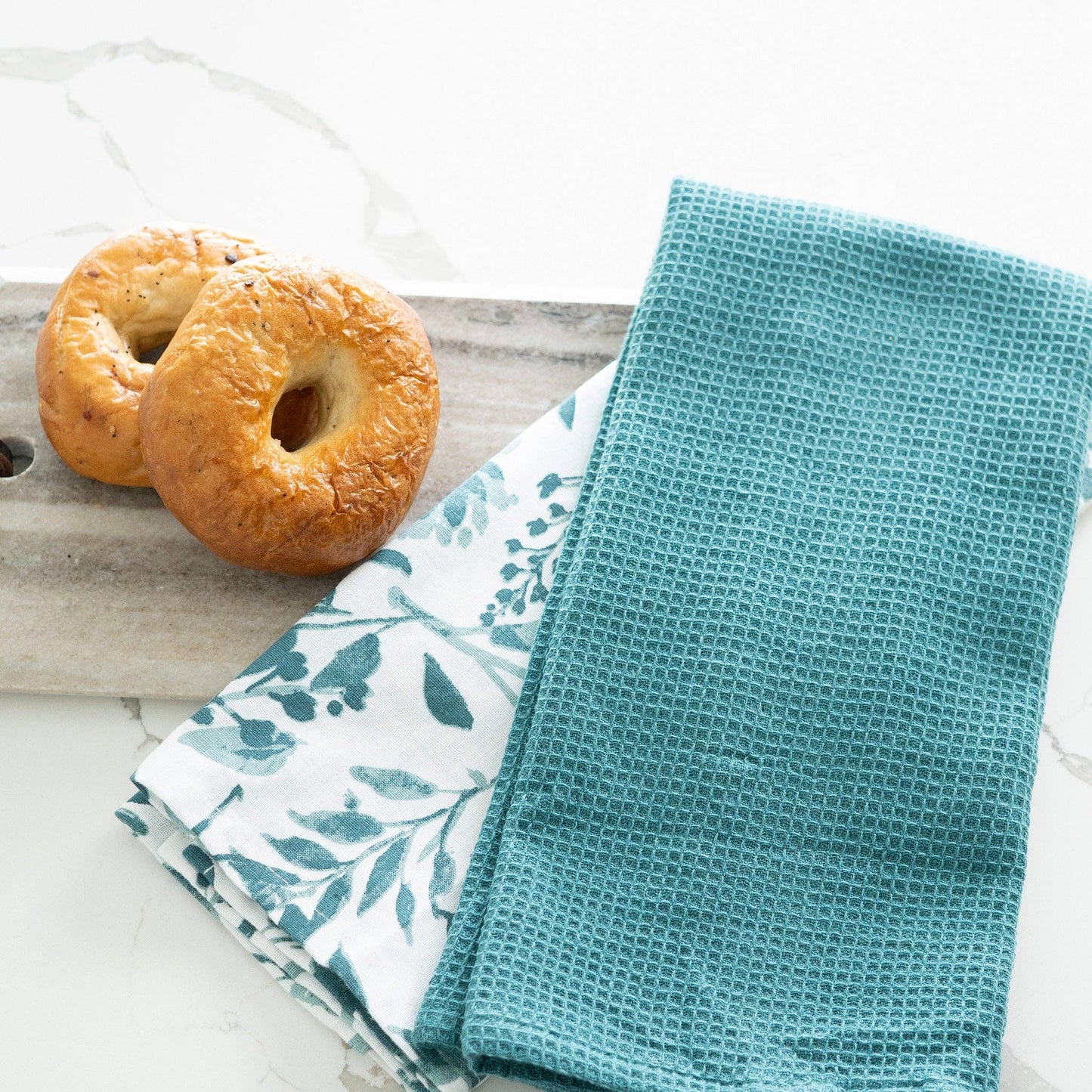 Howard's 3-piece Evergreen Floral Kitchen Tea Towel set featuring festive green and floral designs for kitchen decor.