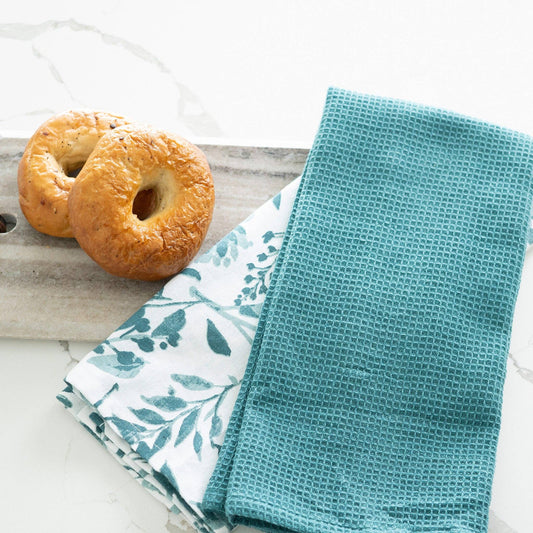 Howard's 3-piece Evergreen Floral Kitchen Tea Towel set featuring festive green and floral designs for kitchen decor.