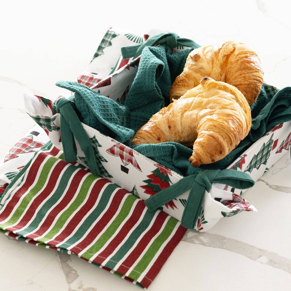 Howard's 4-piece candy cane stripe tea towel and bread basket set, featuring festive red and white holiday-themed linens.