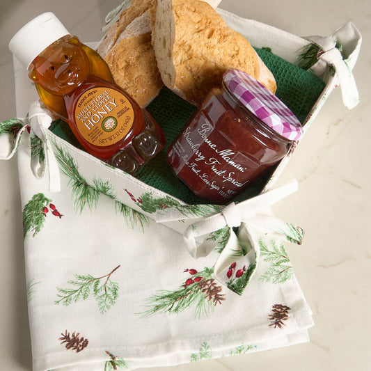 Howard's 4-piece Christmas Winter Pine tea towel and bread basket set with festive pine tree design, perfect for holiday kitchen decor.
