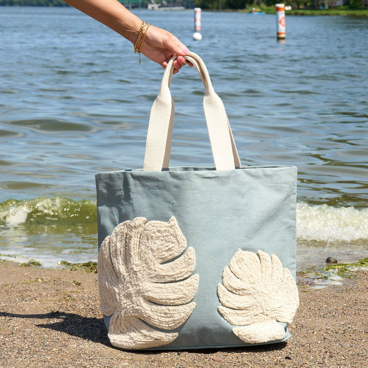 Howard's Fiji Water resistant tote bag with embroidered Monstera leaf design, durable fabric and stylish tropical-inspired pattern.