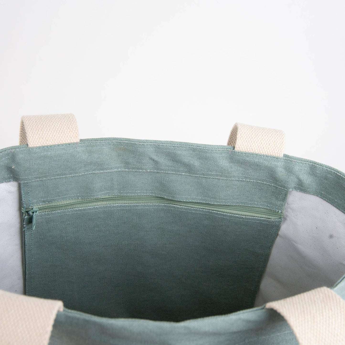 Howard's Fiji Water Resistant Tote Bag featuring embroidered Monstera leaf design, showing durable fabric and stylish tropical leaf pattern.