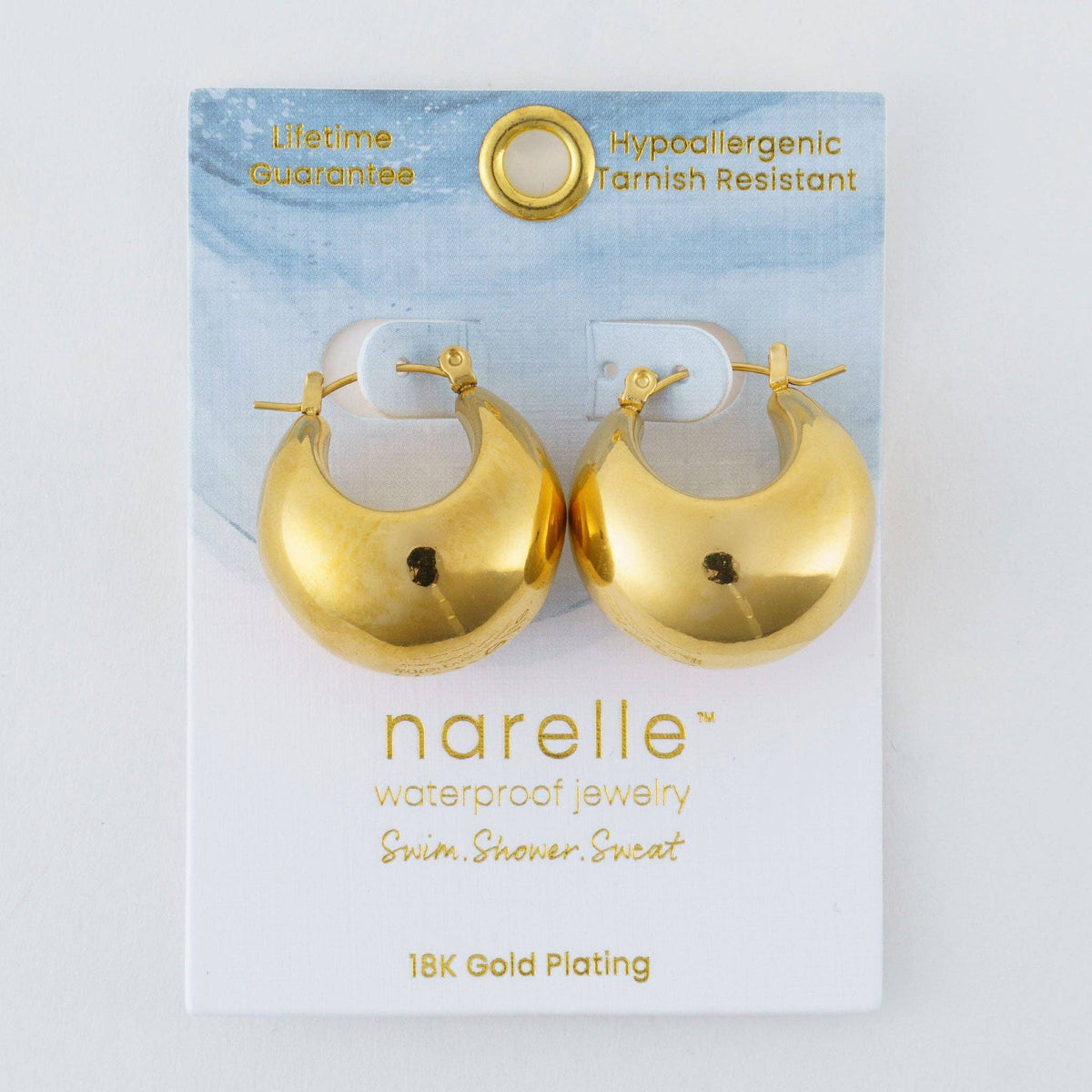Howard's Narelle waterproof silver bowl hoop earrings with a sleek, modern design, shown close-up against a neutral background.