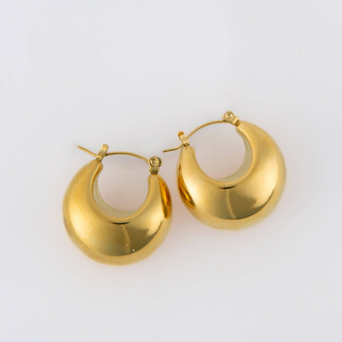 Silver Narelle waterproof bowl hoop earrings with a sleek, modern design, featuring a silver finish and smooth, rounded shape.