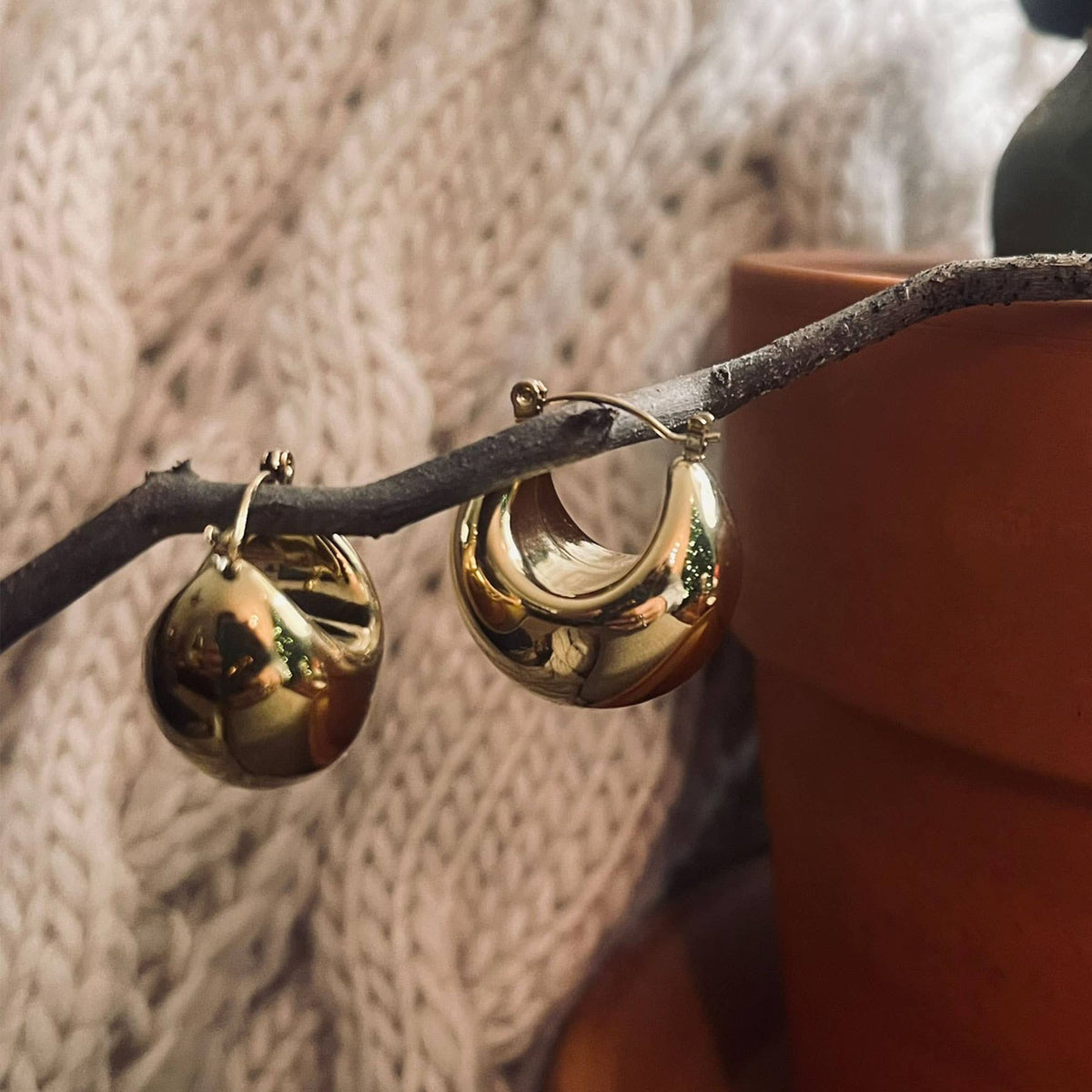 Silver Narelle waterproof bowl hoop earrings by Howard's, showcasing smooth, rounded hoop design with a polished finish.