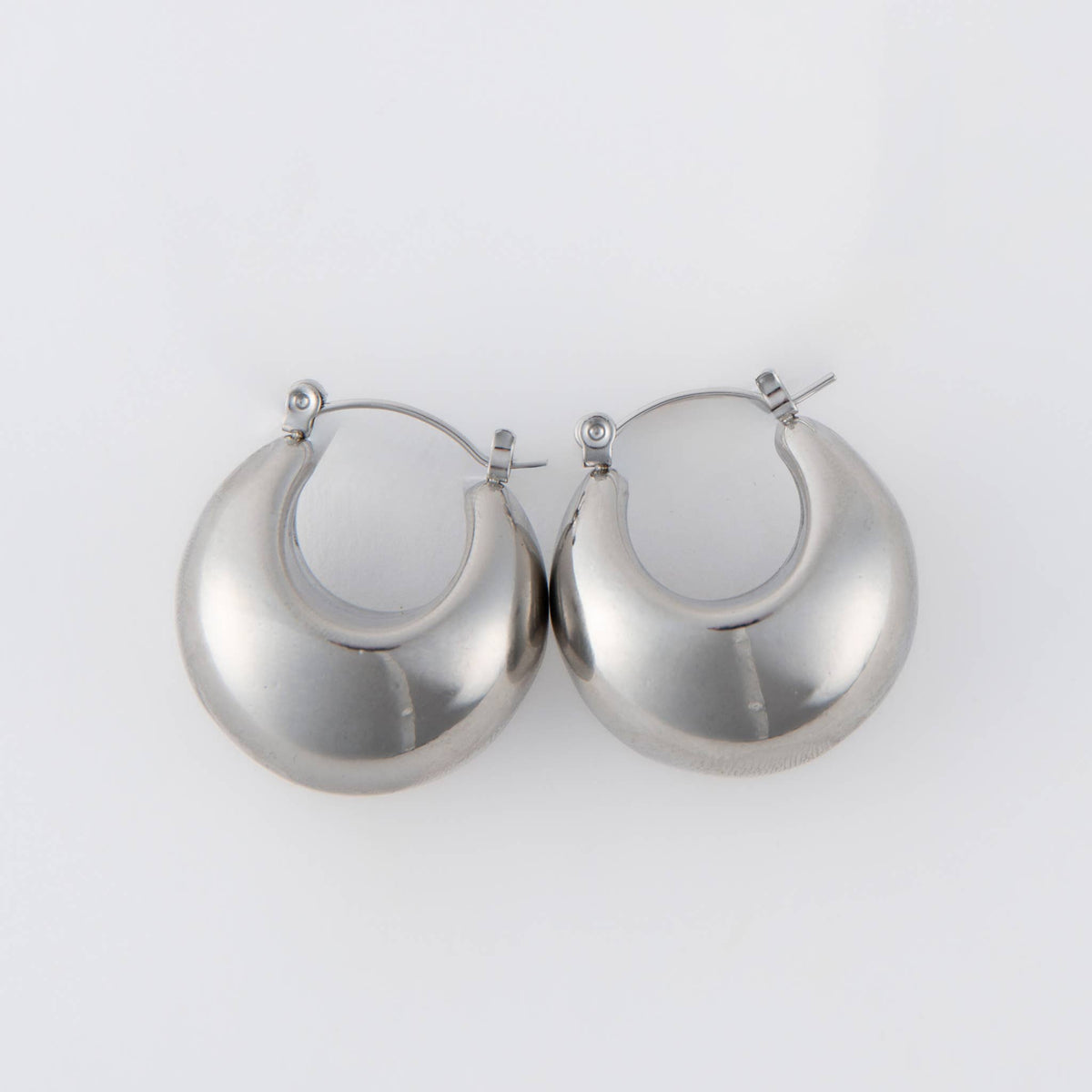 Silver Narelle waterproof bowl hoop earrings by Howard's featuring smooth, rounded hoop design with a shiny finish.