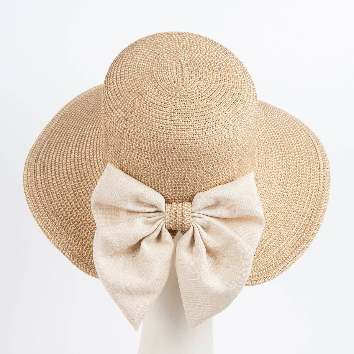 Howard's Zaya Boho Ponytail Sun Hat with Bow in sand shell, featuring wide brim and stylish design for sun protection.
