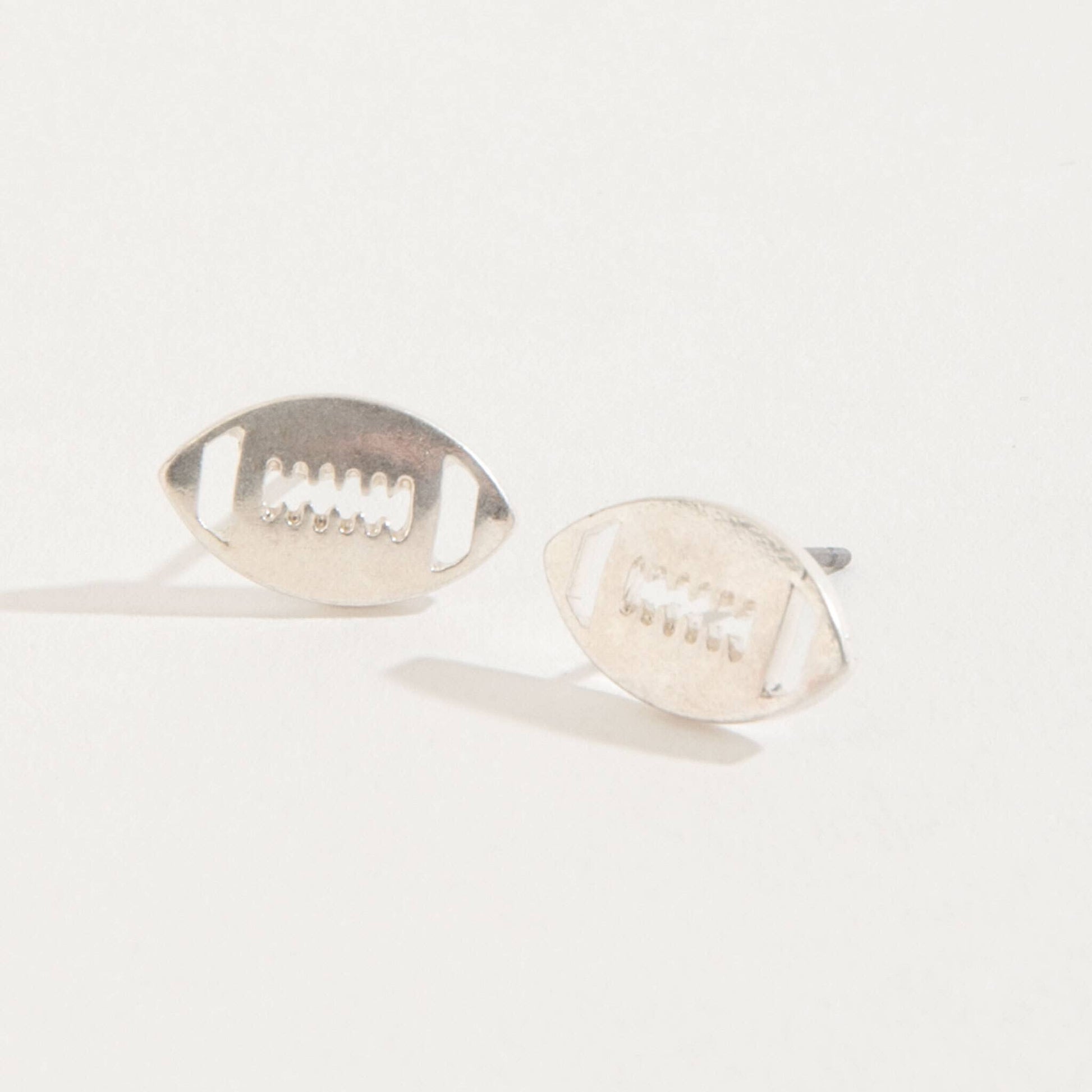 Howard's football stud buds earrings featuring small, detailed football-shaped designs perfect for casual or sporty jewelry styles.