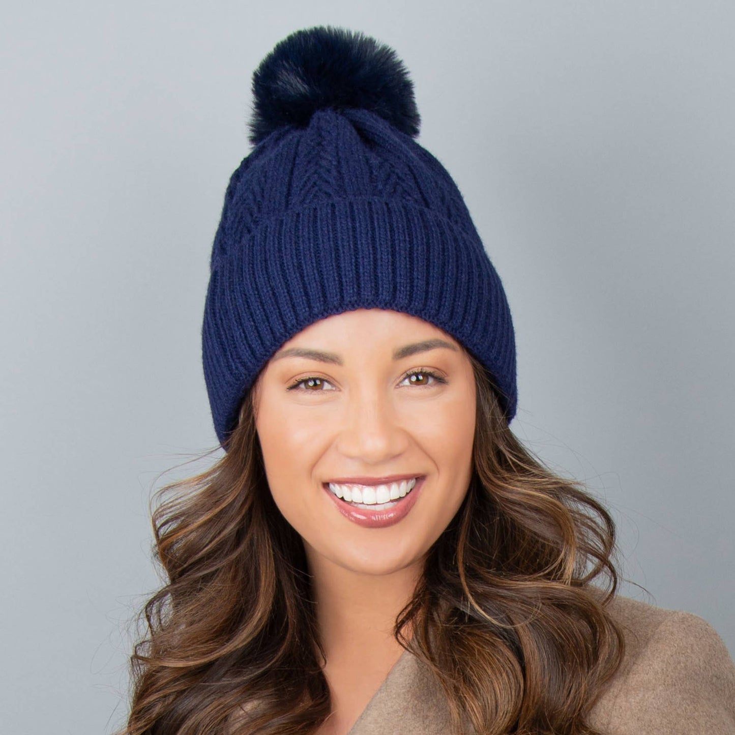 Howard's Roxanne Knit Pom Lined Beanie Hat with cozy knit fabric and playful pom pom on top.