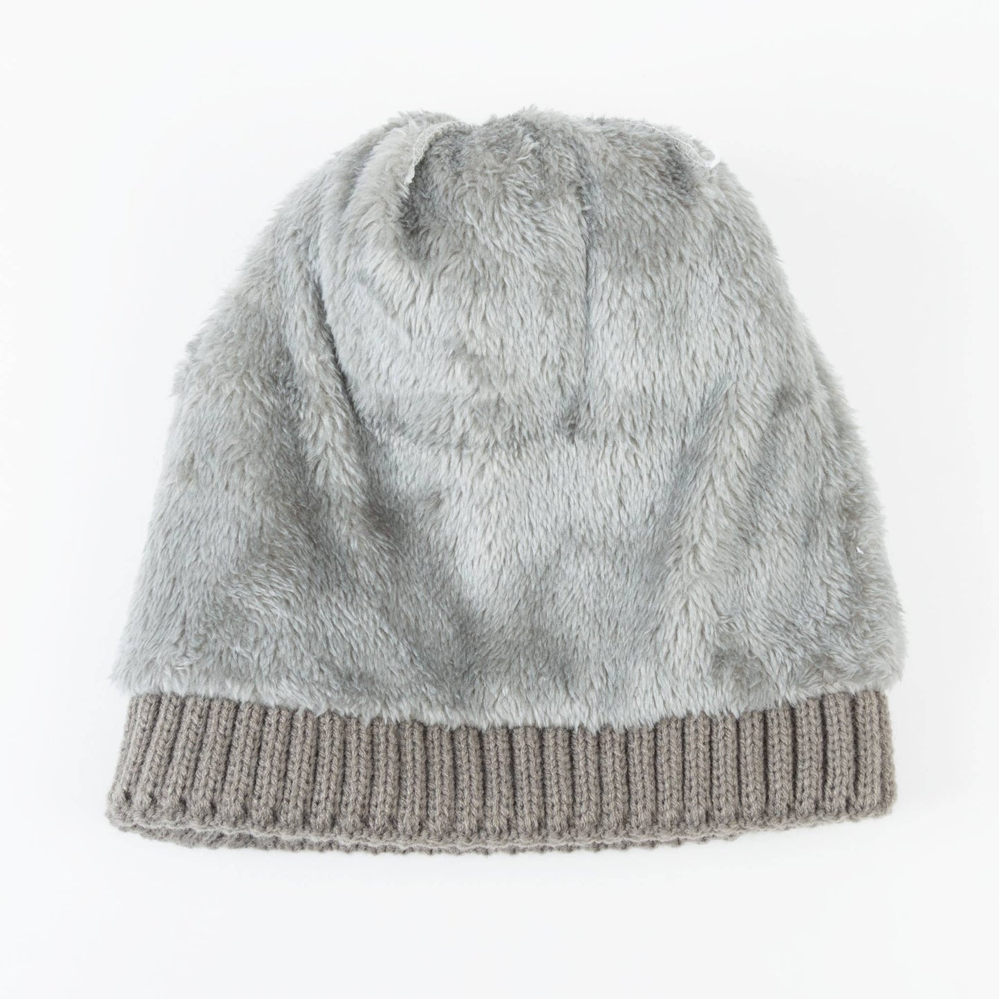 Howard's Roxanne Knit Pom Beanie hat with lined interior, featuring a cozy knit design and playful pom pom on top.