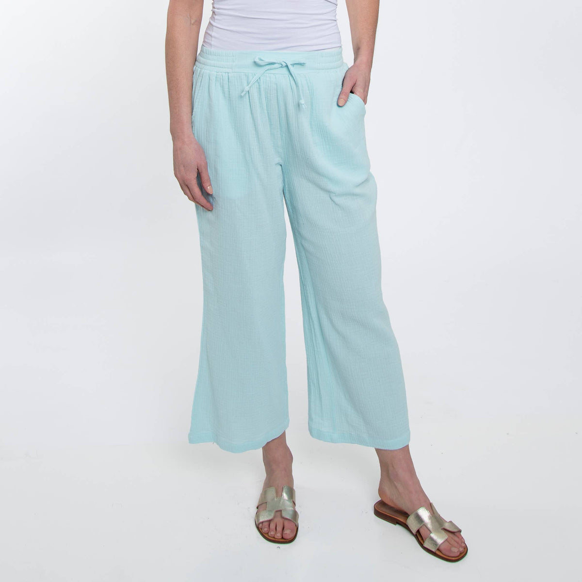 Howard's cotton cropped pants shown on a model, featuring a relaxed fit and casual style perfect for everyday wear.