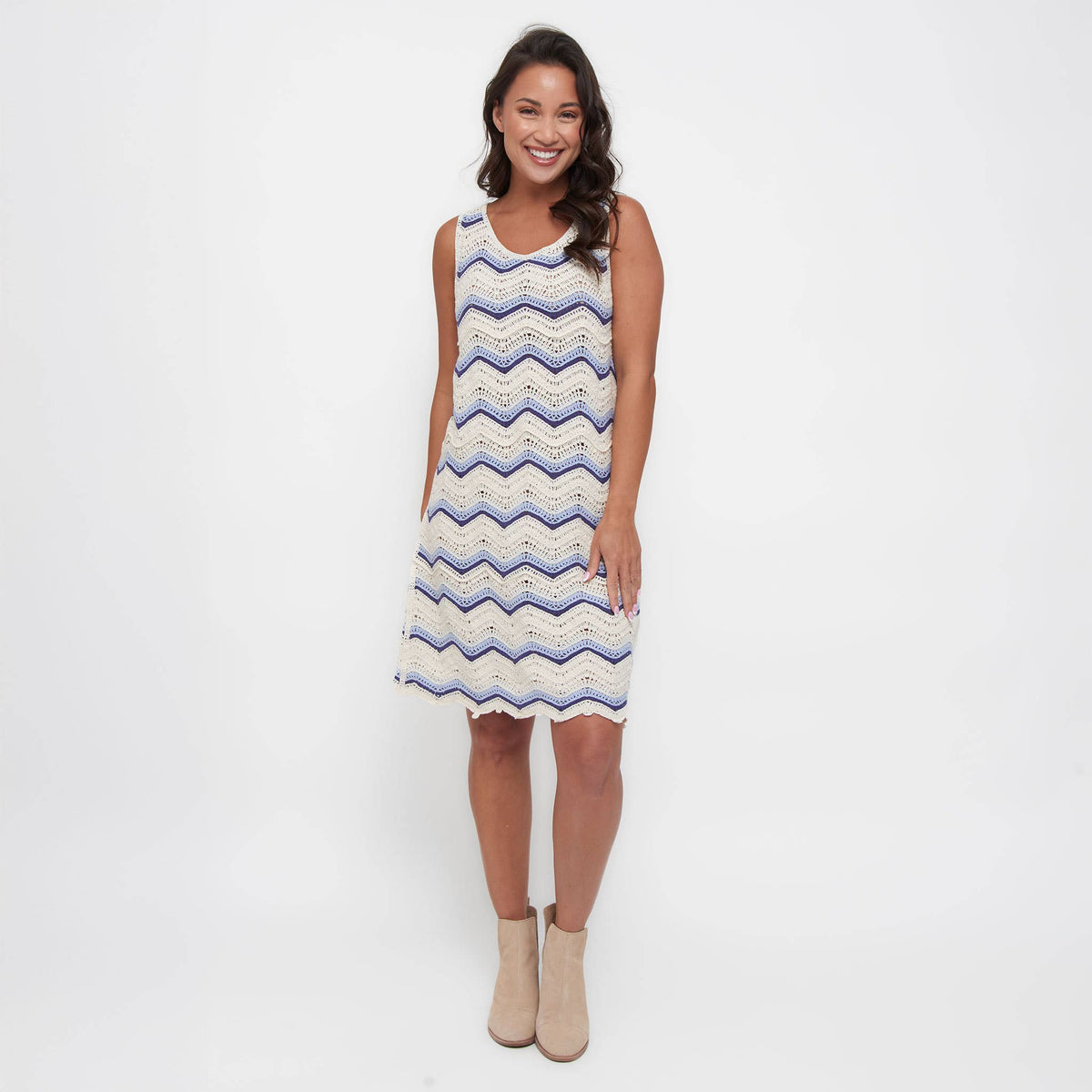 Howard's sleeveless crochet dress featuring intricate open-knit design and a flattering fit, perfect for summer or casual wear.