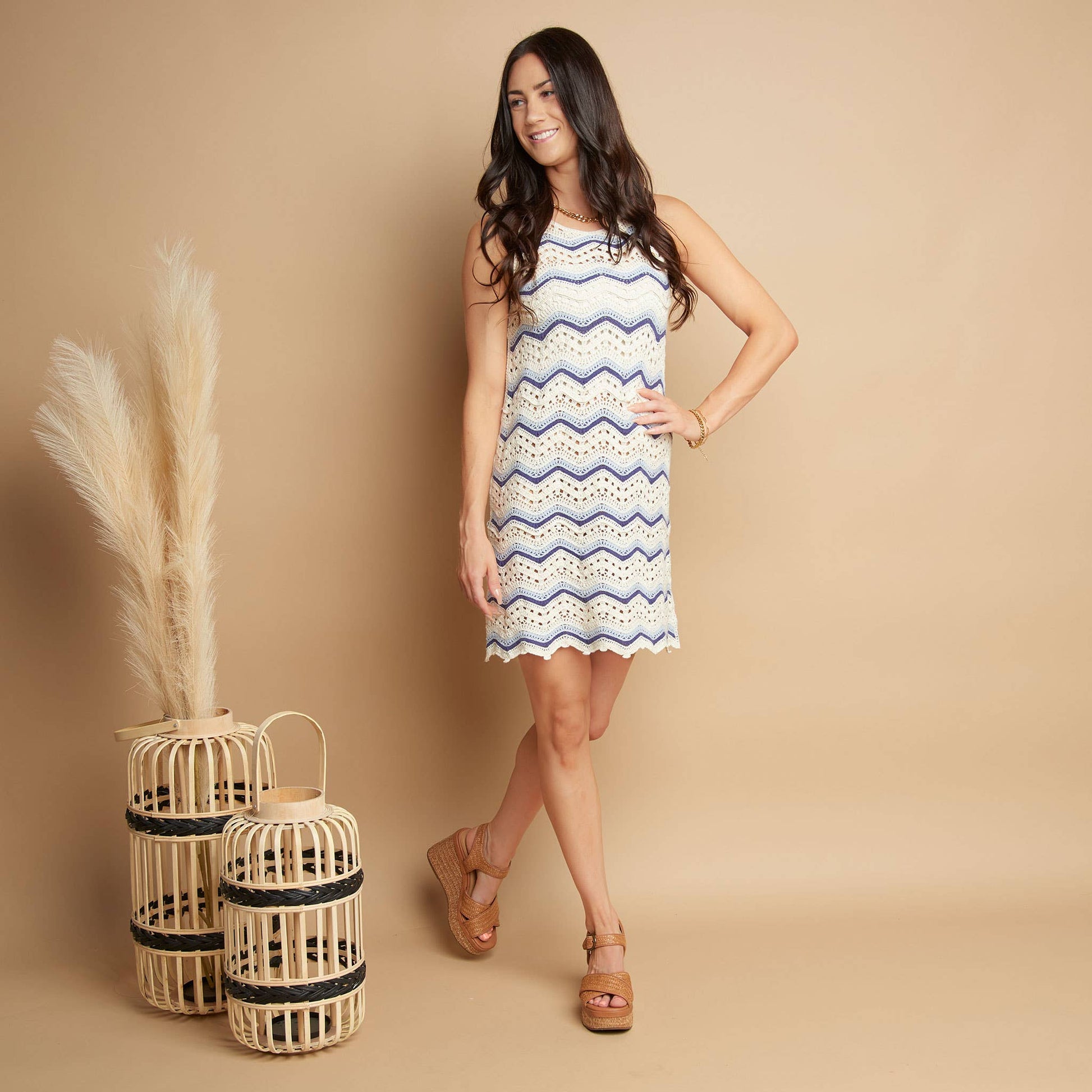 Howard's sleeveless crochet dress displayed on a mannequin, featuring intricate crochet pattern and lightweight summer style.