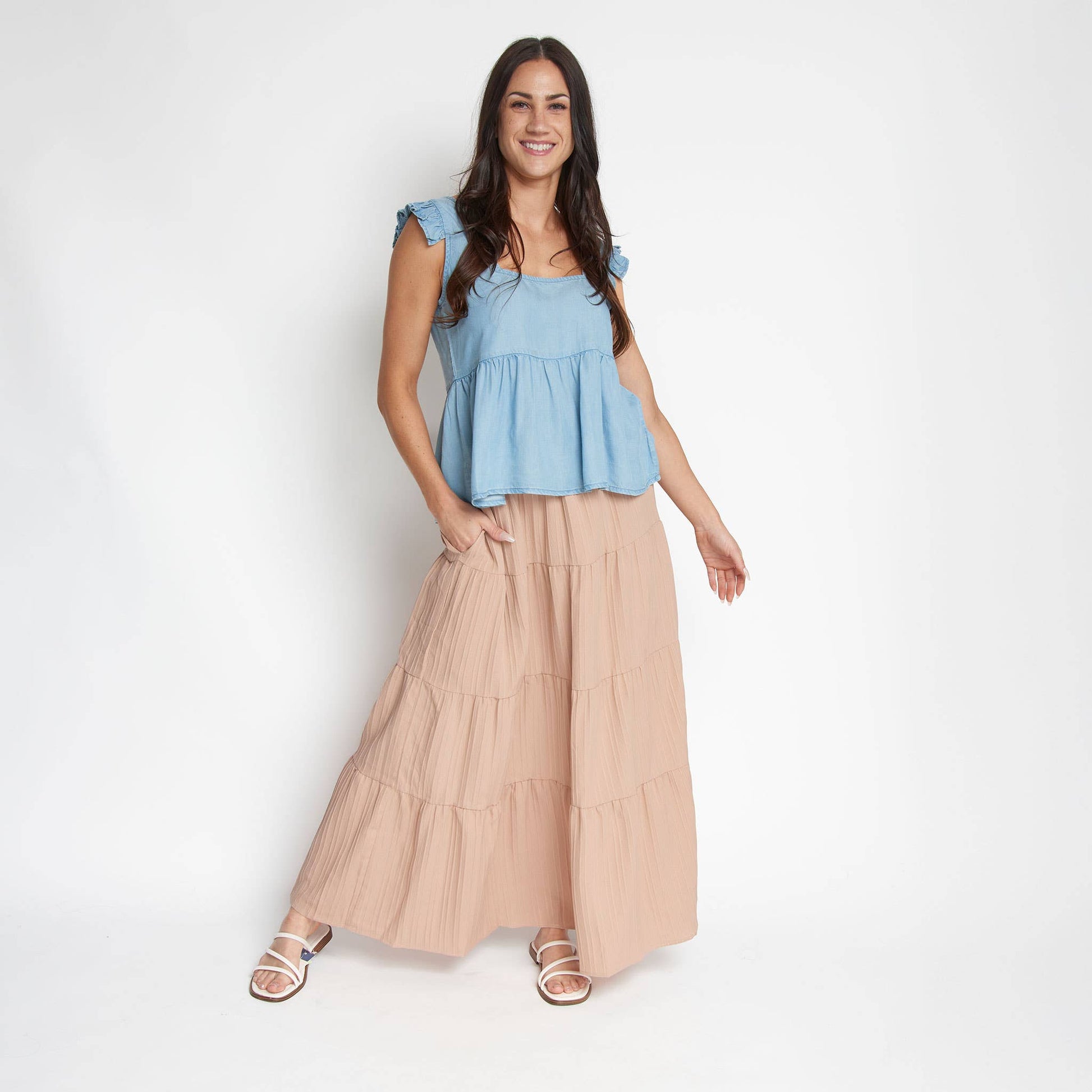Howard's McKay tiered rosewater maxi skirt with pockets, featuring a flowing design and vibrant rosewater color.