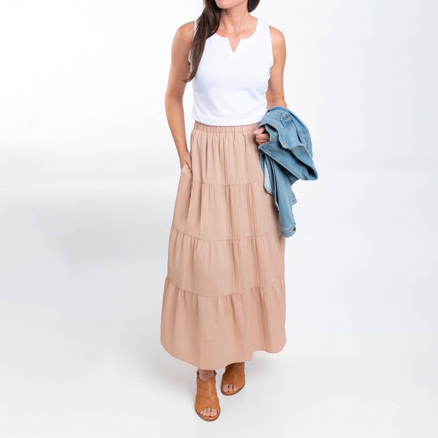 Howard's McKay tiered rosewater maxi skirt with pockets, featuring flowing fabric and a vibrant floral pattern.