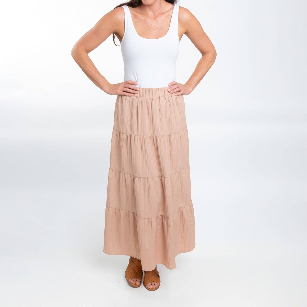Howard's McKay tiered rosewater maxi skirt with pockets, featuring a flowing design and vibrant color, perfect for casual wear.