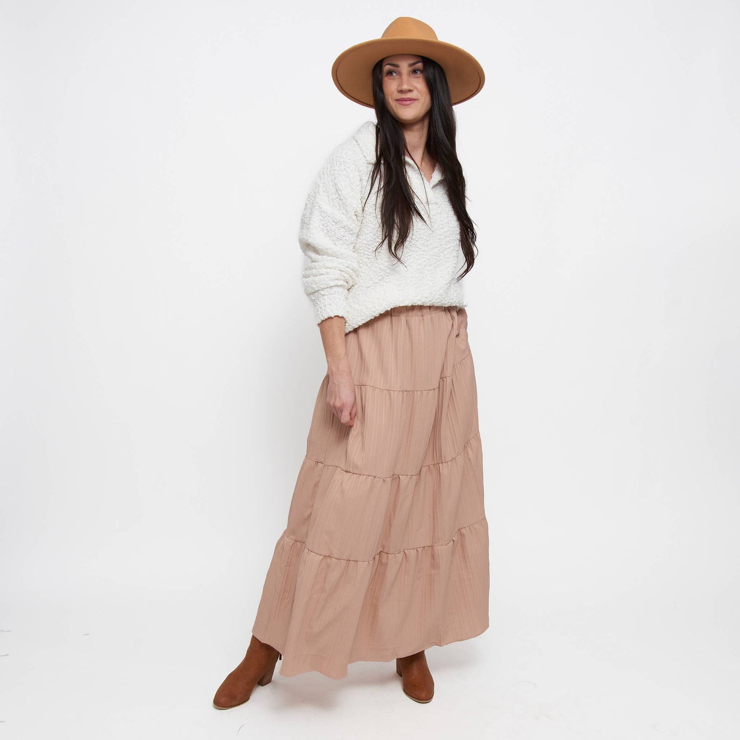 Howard's McKay tiered rosewater maxi skirt with pockets, featuring a flowing design and soft fabric in a pastel rosewater color.