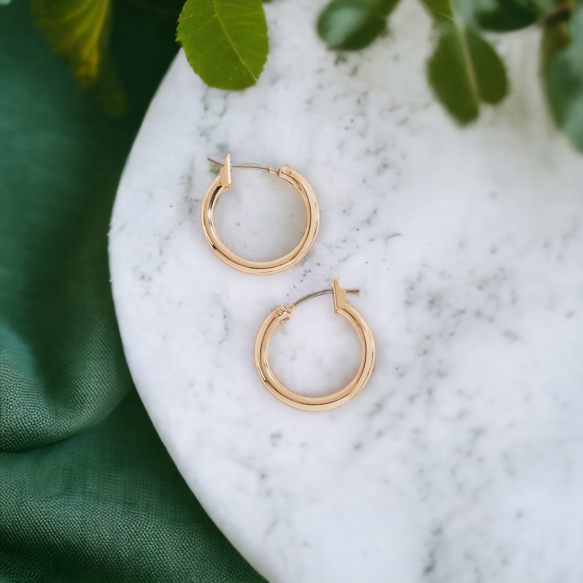 Howard's Ear Sense Click Hoop Earrings shown in gold with a sleek, modern design and secure click closure.