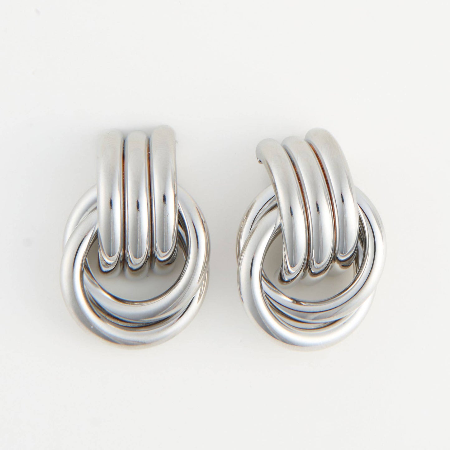 Howard's Solara interlocking triple knot stud earrings in silver, featuring a sleek, modern design with polished finish.