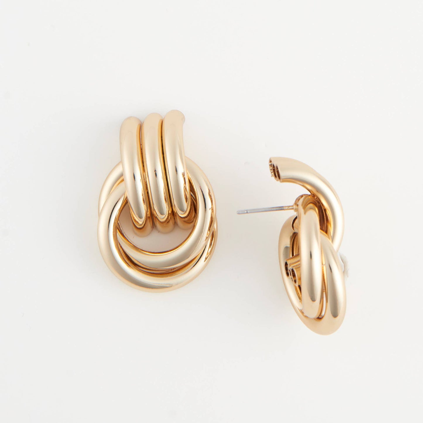 Howard's Solara interlocking triple knot stud earrings featuring sleek, silver-tone metal design and small post closures.