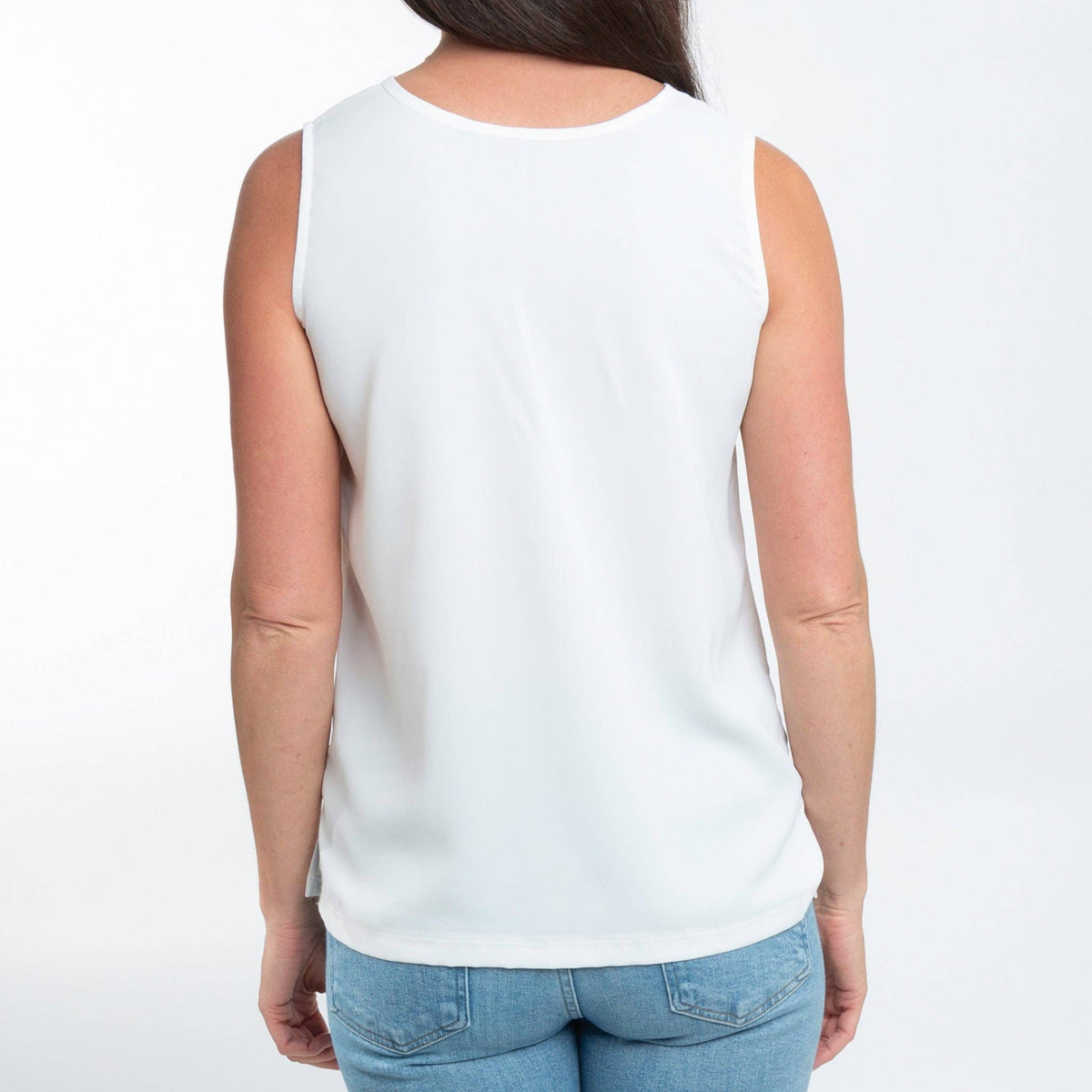 Howard's Indie sleeveless white tank top blouse with V-neck, casual and lightweight, perfect for warm weather and layered outfits.