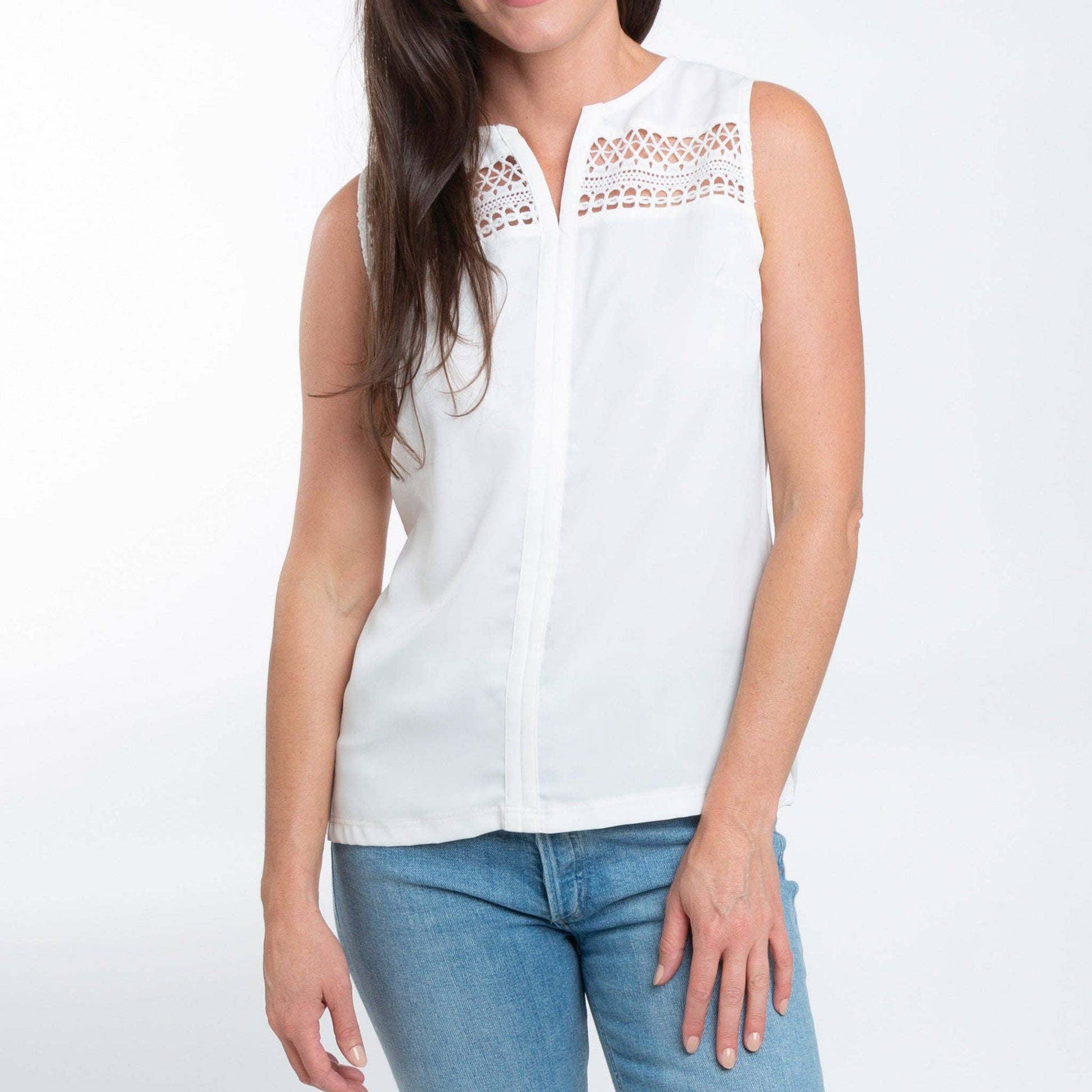 Howard's white sleeveless V-neck tank top blouse with a relaxed fit and clean design, ideal for casual or layered outfits.