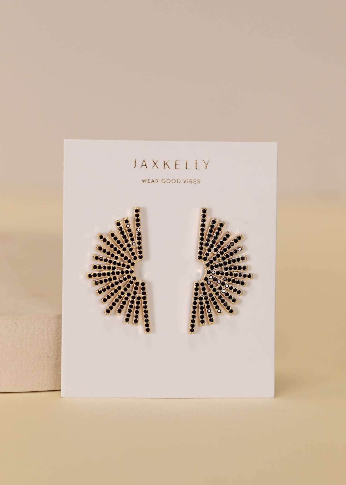 Black sunburst gold earrings from Jax Kelley Celestial collection, featuring intricate celestial-inspired design.