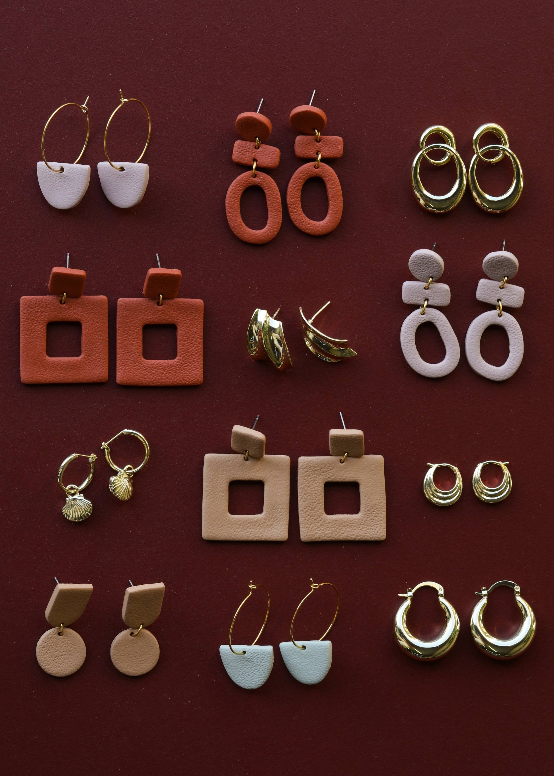 Organic three-tier clay earrings in almond rose color by Jax Kelley, featuring layered, handcrafted jewelry with a natural, earthy look.