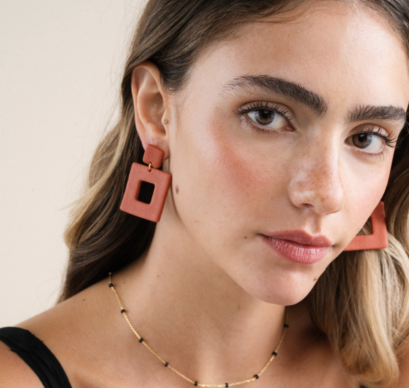 Square terracotta clay earrings by Jax Kelley featuring geometric design and natural earthy tones.