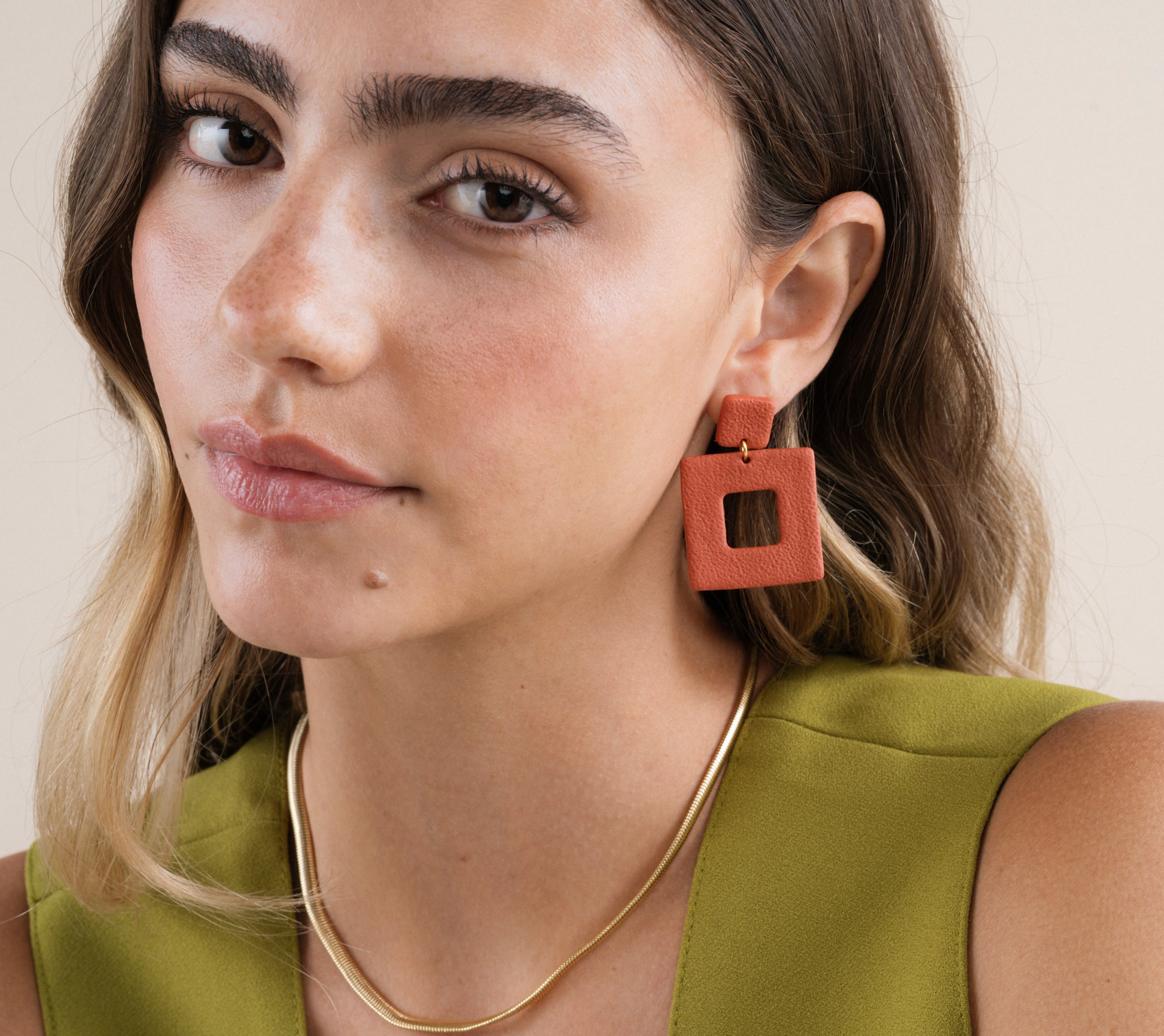 Square terracotta clay earrings by Jax Kelley featuring a natural, earthy design with a smooth, matte finish.