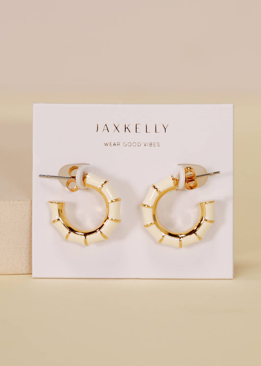 Vintage hoop earrings by Jax Kelley featuring cream enamel finish and classic round design.